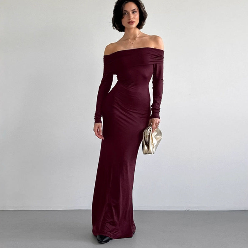 Off-the-shoulder sheath dress in elegant fabric, showcasing a fitted silhouette and stylish neckline by M Chic Boutique.