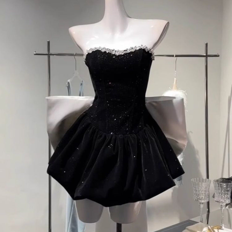 High-end light luxury dress from M Chic Boutique featuring a stylish bow detail, showcasing elegant fabric and design.