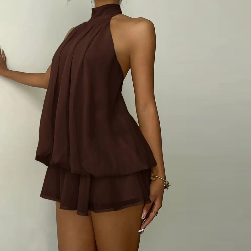 Elegant halter mini dress with bow detail, featuring a fitted silhouette and soft fabric from M Chic Boutique.