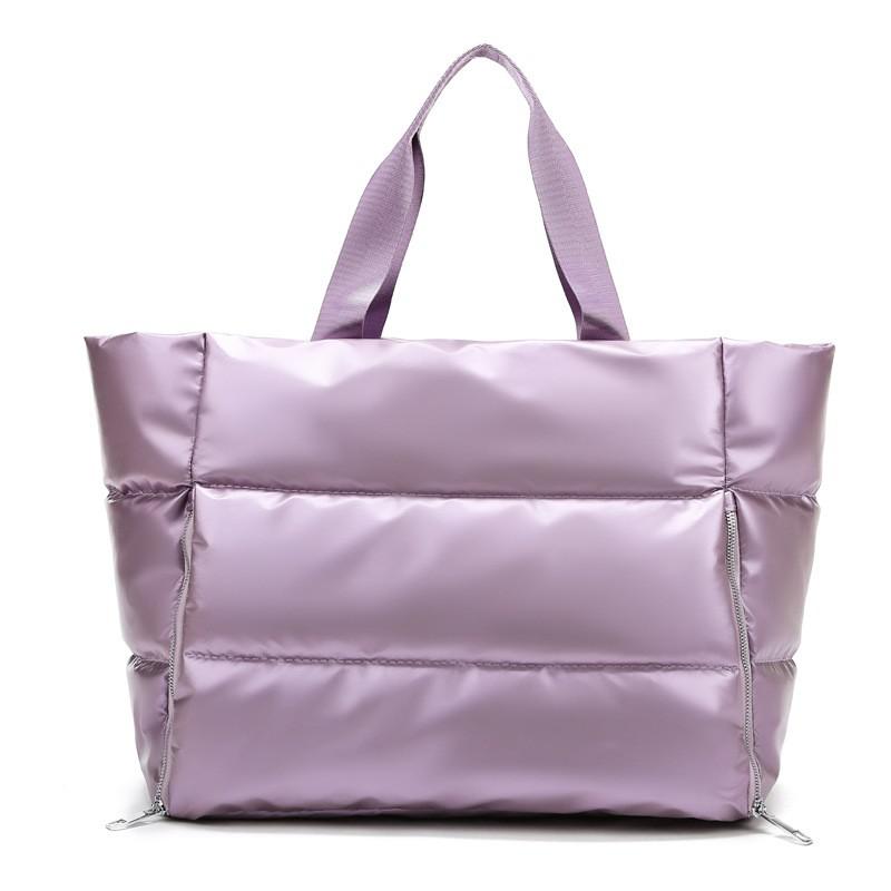 Women's gym bag by M Chic Boutique, stylish and spacious tote with ample compartments for workout essentials.