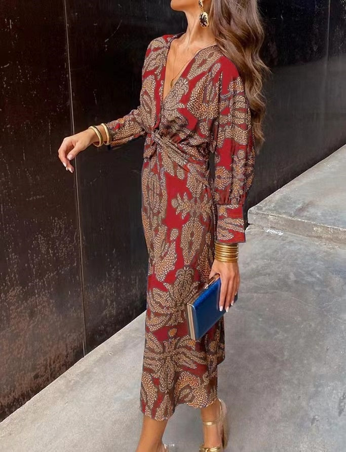 Nine-quarter sleeve V-neck painted dress by M Chic Boutique, featuring a colorful, stylish design and comfortable fit.