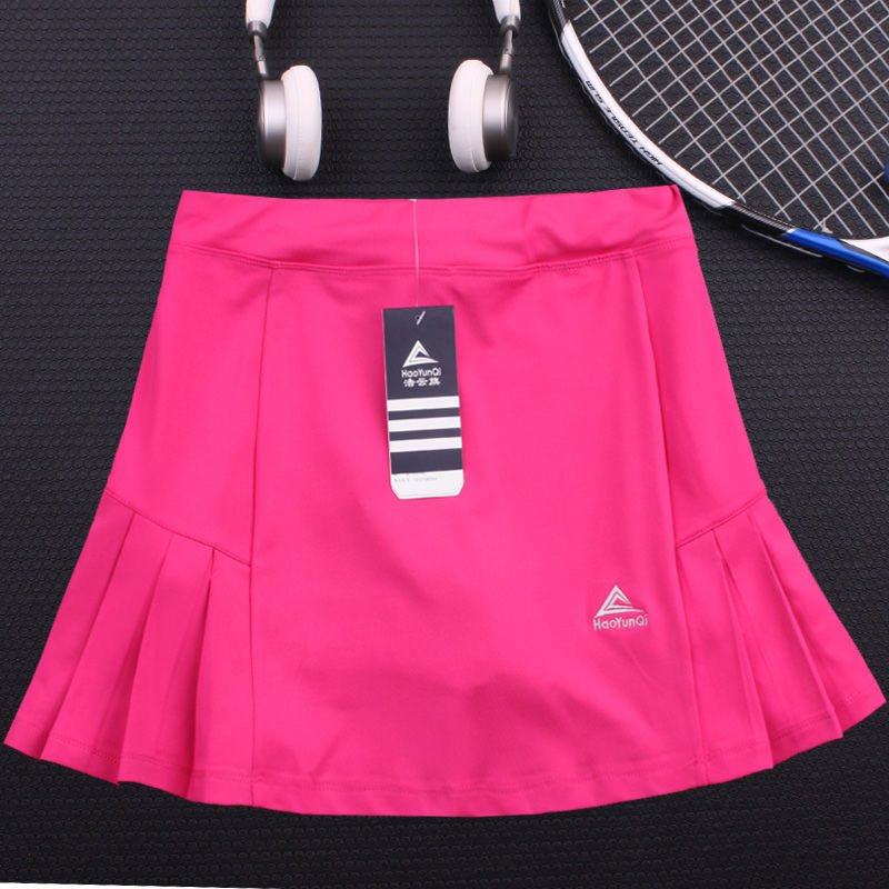 Pink quick-drying tennis skirt from M Chic Boutique activewear collection, featuring a fitted waistband and breathable fabric.