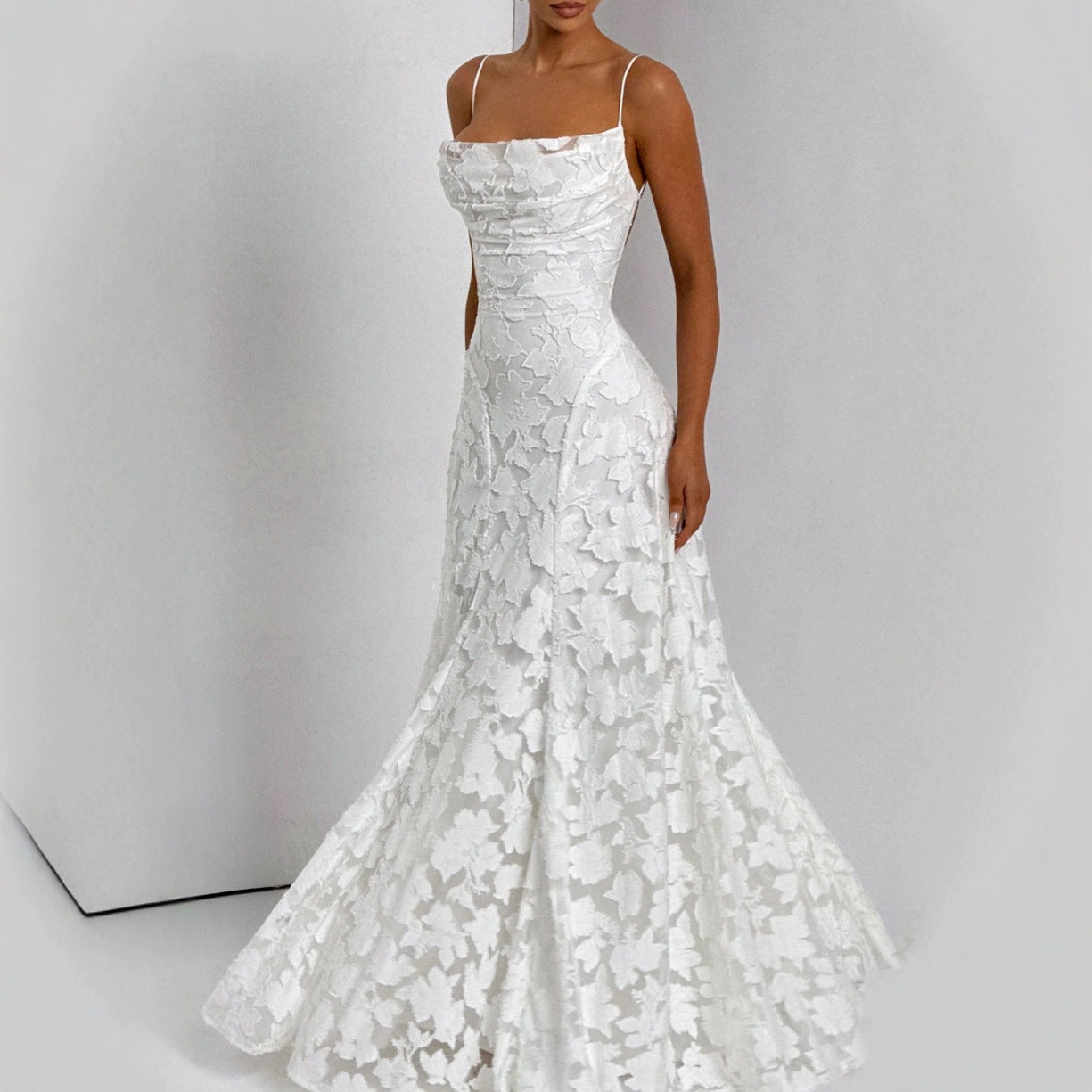 Backless lace-up design dress by M Chic Boutique featuring a stylish, elegant silhouette and intricate lace-up details.