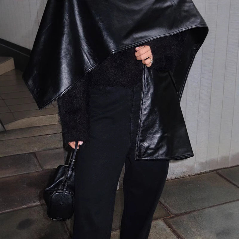M Chic Boutique Trend Shawl Cape Coat draped over a mannequin, showcasing stylish and cozy outerwear with a flowing design.