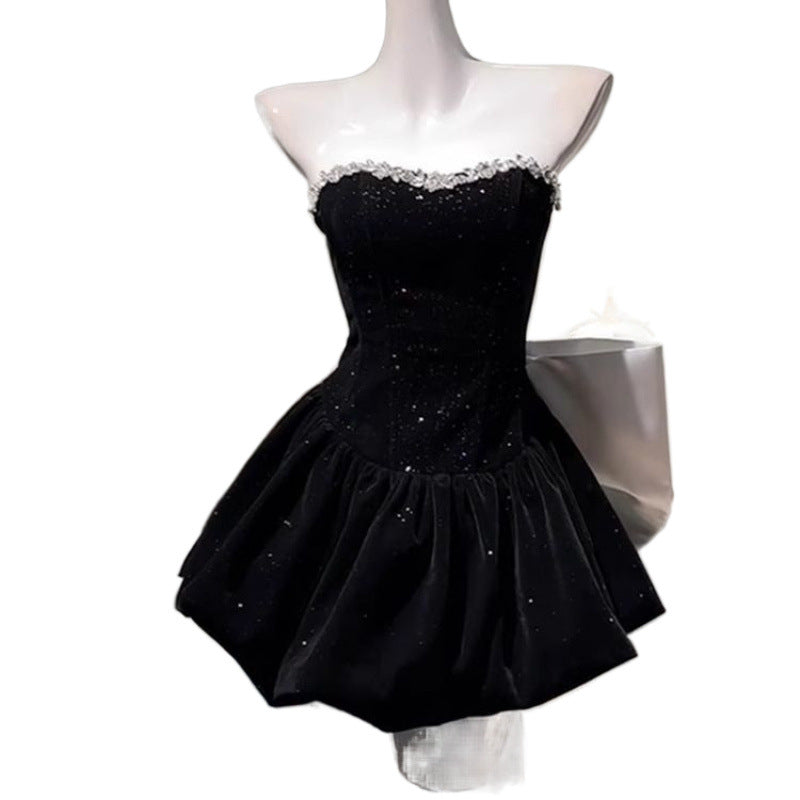 Elegant M Chic Boutique light luxury dress with a bow detail, showcasing a sophisticated design and fine fabric.
