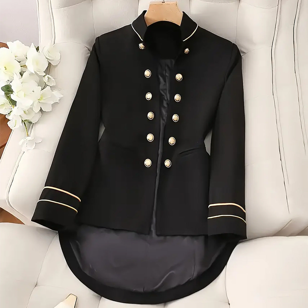 Elegant high-end coat by M Chic Boutique displayed on a mannequin, featuring a tailored fit and luxurious fabric.
