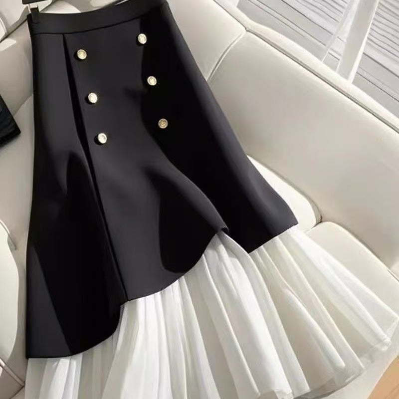 Splicing half skirt with buttons in a stylish design, showcasing fabric texture and button details from M Chic Boutique.