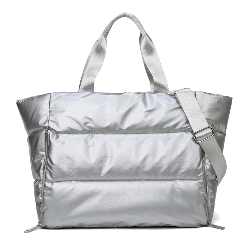 Women's gym bag by M Chic Boutique, stylish and spacious bag with handles and compartments for workout essentials.