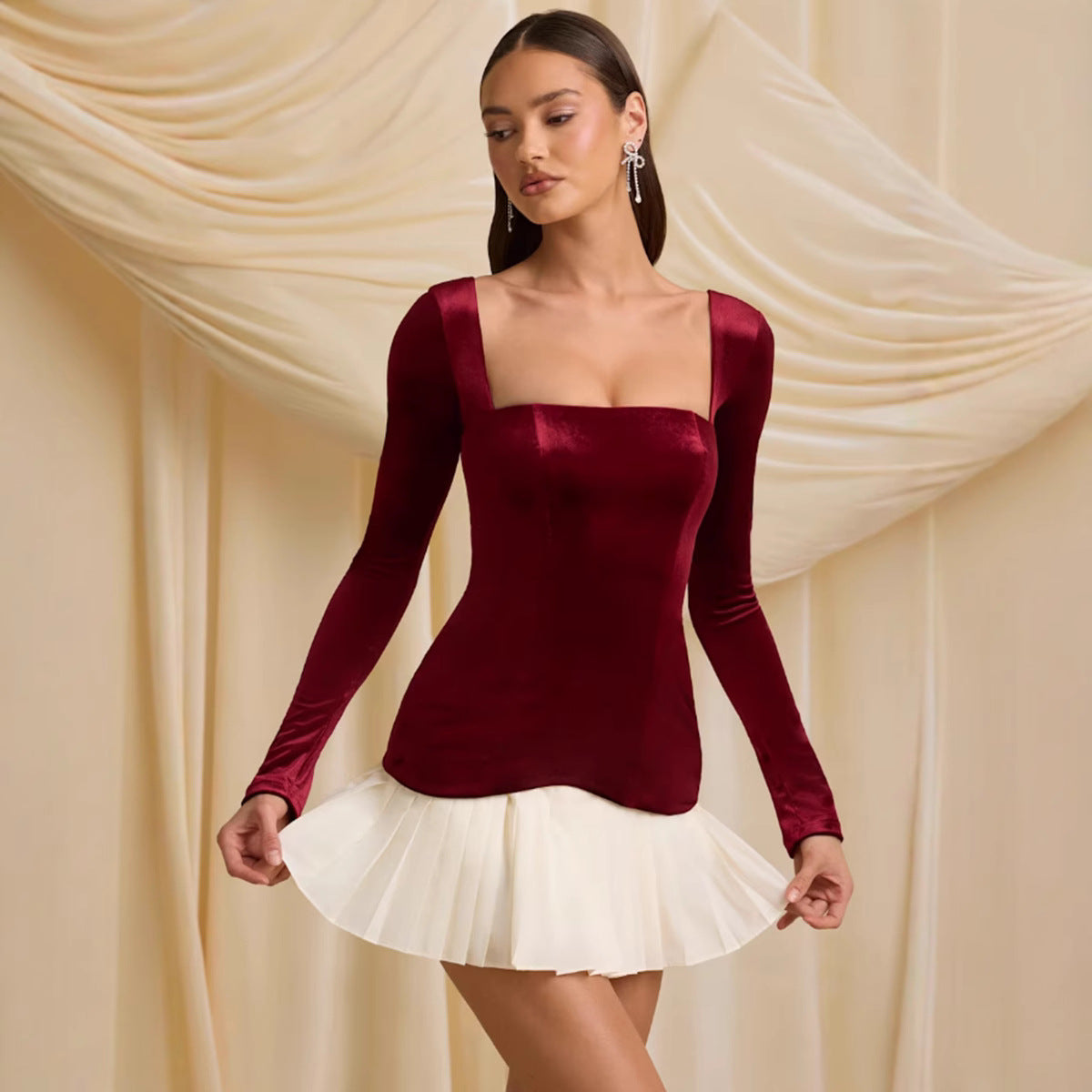 Square collar pleated dress in soft fabric, showcasing elegant pleats and a feminine silhouette by M Chic Boutique.