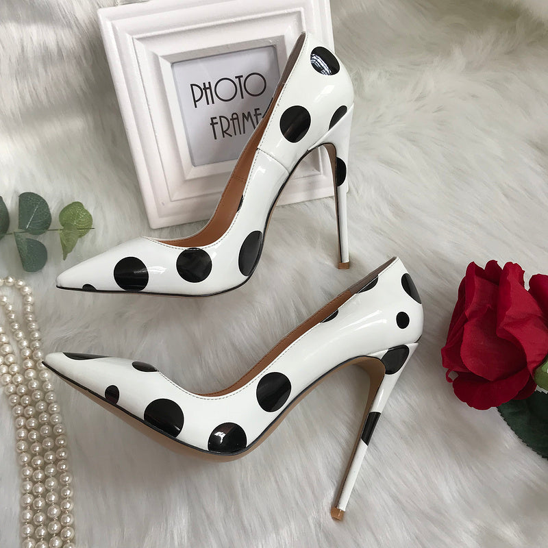 Polka dot leather high heels by M Chic Boutique, featuring a stylish design with a pointed toe and slim heel.
