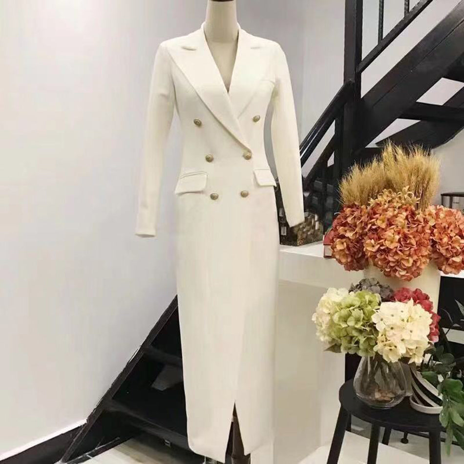 Slim long double-breasted dress from M Chic Boutique, showcasing a tailored fit and elegant design in a stylish setting.