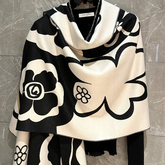 Black and white versatile scarf from M Chic Boutique, featuring a stylish, high-grade fabric with an elegant, flowing design.