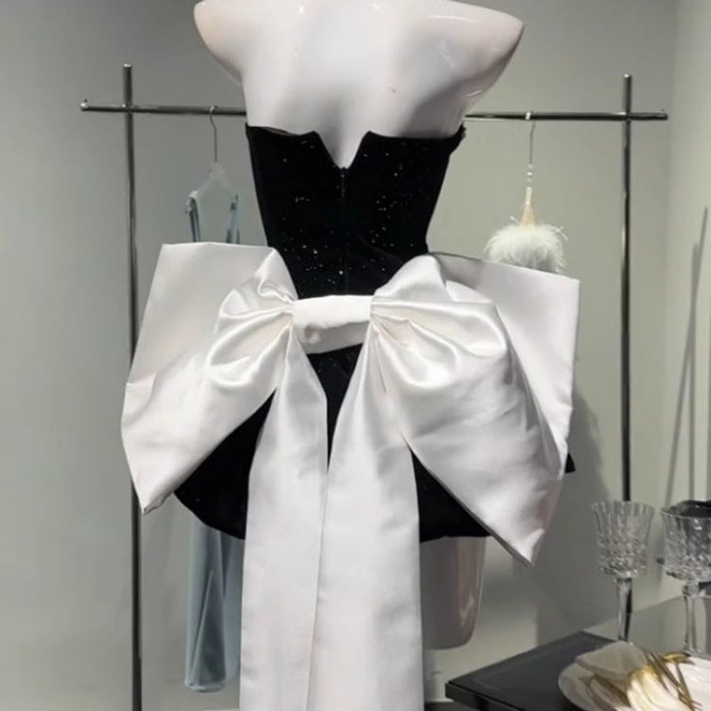 High-end light luxury dress with a bow detail, featuring elegant design and stylish fabric from M Chic Boutique.