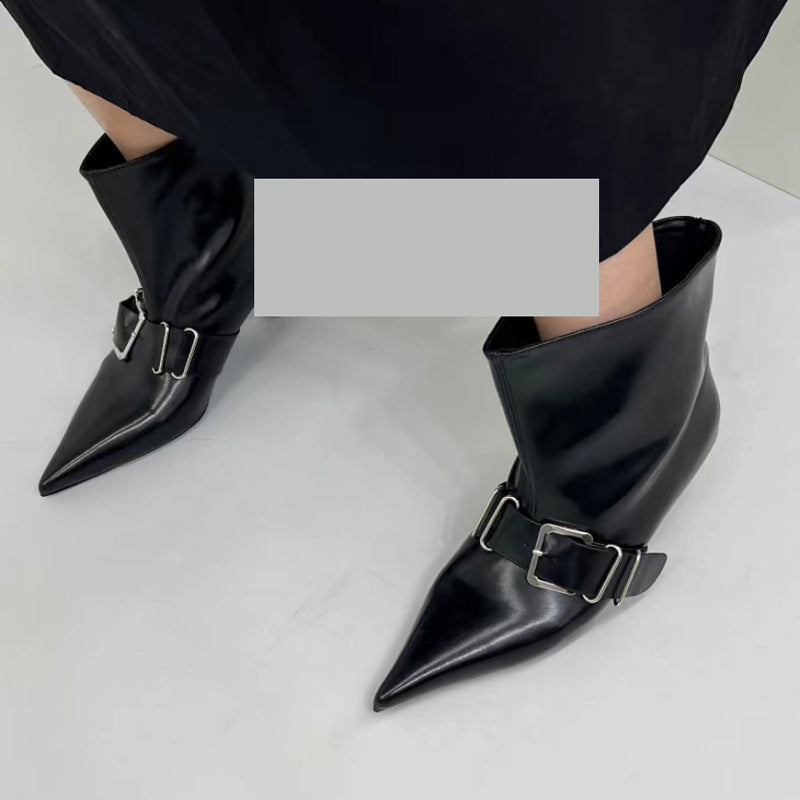 High heel pointed ankle boots in black leather by M Chic Boutique, featuring a sleek design and stylish pointed toe.