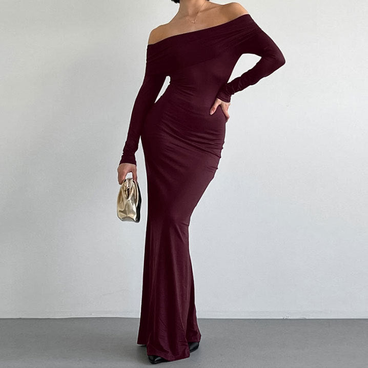 Off-the-shoulder sheath dress in a fitted style, showcasing elegant fabric and a flattering silhouette by M Chic Boutique.