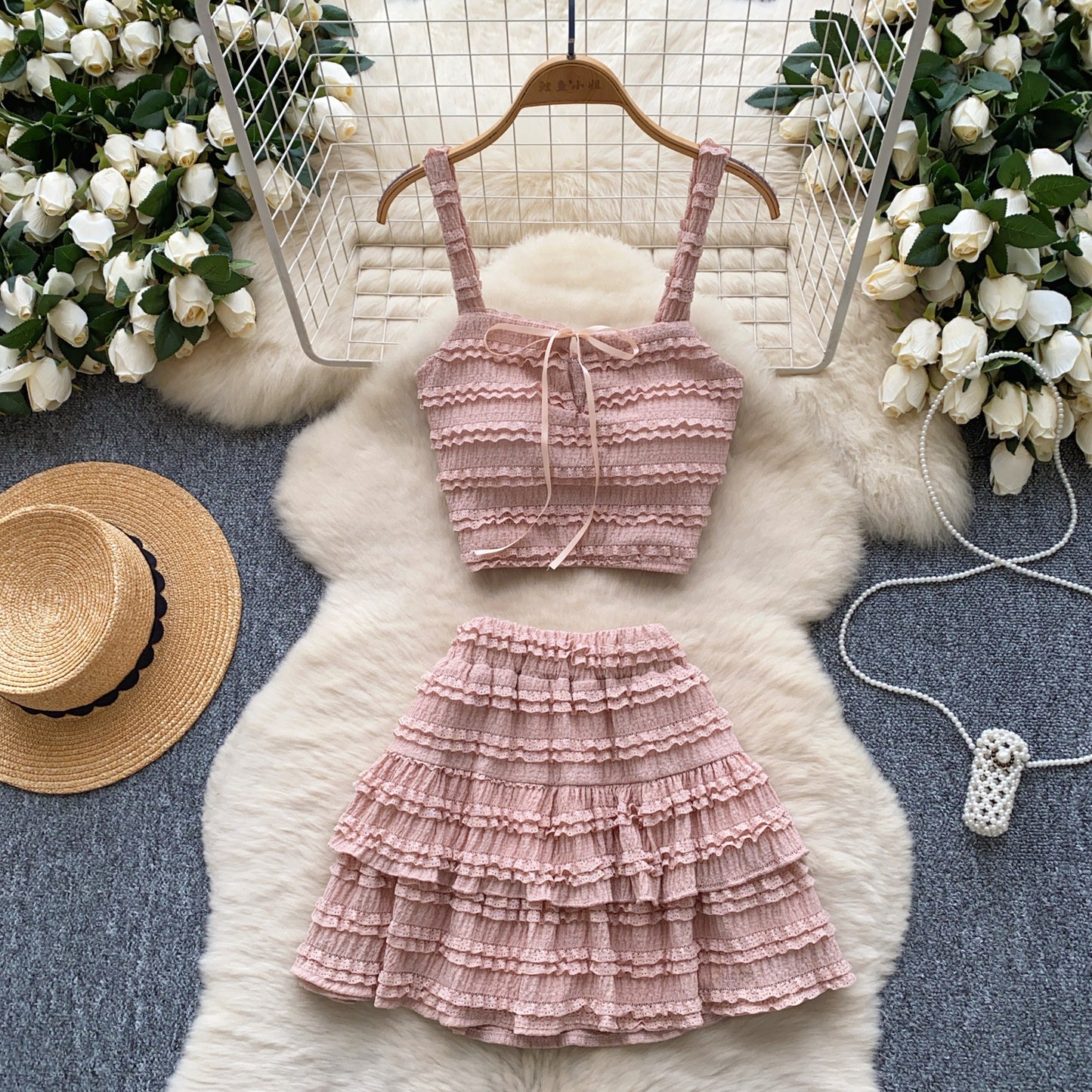 Square-neck slip dress with high waist and pleated ruffled hem, part of M Chic Boutique's two-piece set, displayed on a hanger.