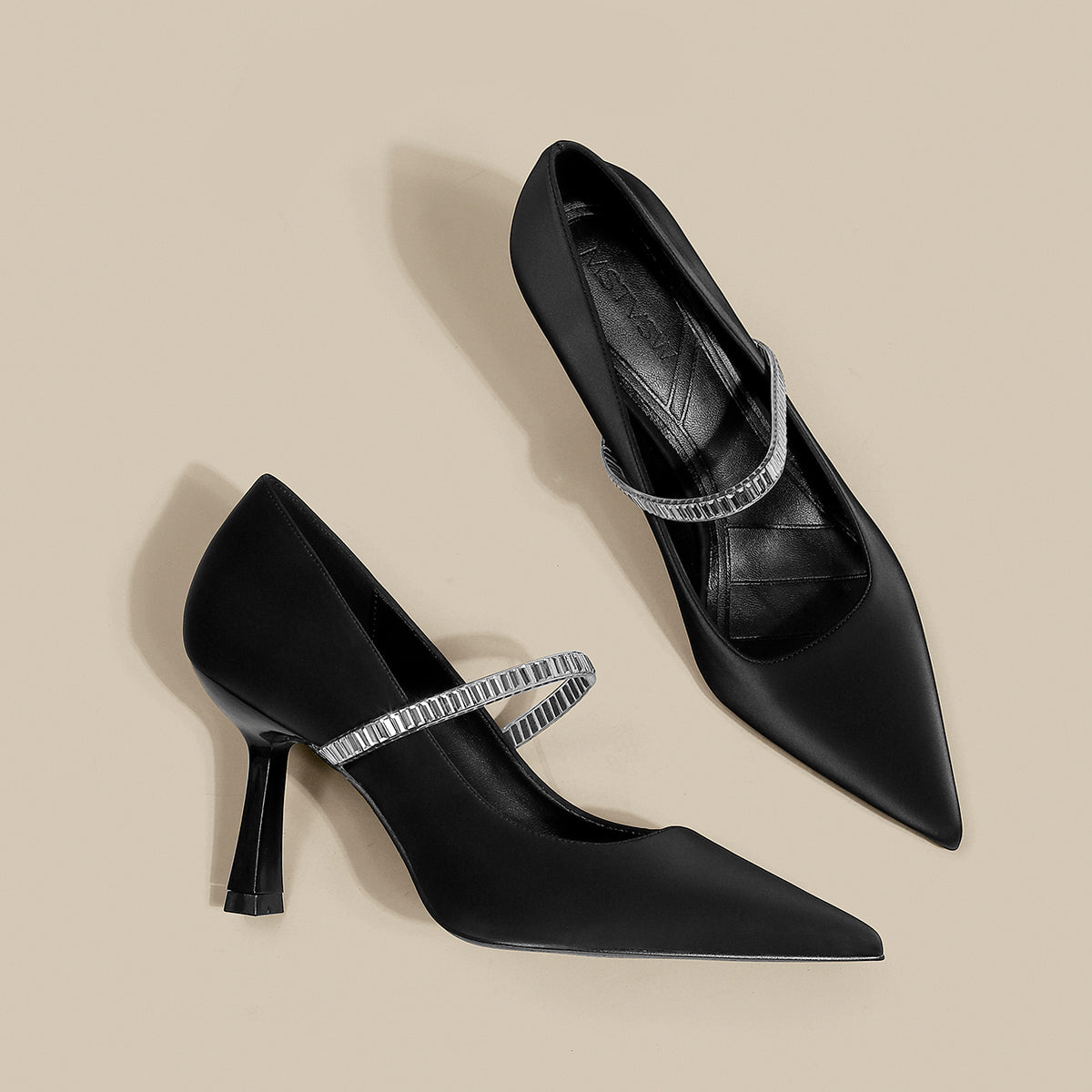 Pointed toe shoes with strap from M Chic Boutique, featuring a sleek design and elegant silhouette in a stylish color.