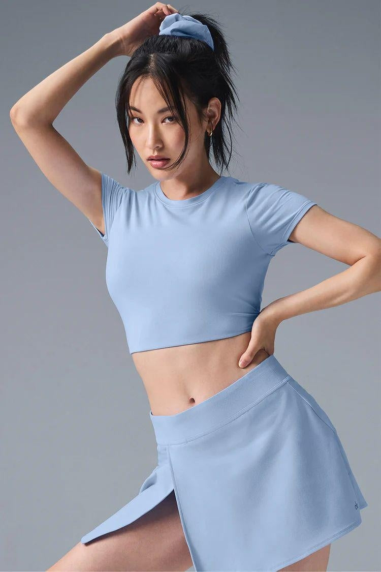 M Chic Boutique activewear top and skirt set, stylish athletic clothing for women, shown in a coordinated sportswear ensemble.