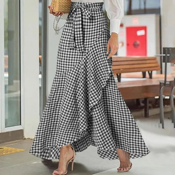 Plaid mermaid irregular skirt by M Chic Boutique featuring a unique asymmetrical hem and vibrant check pattern.
