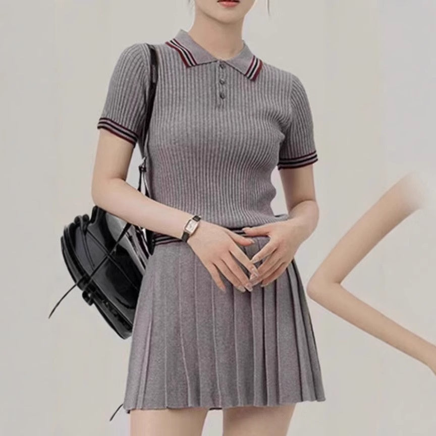 Water image showing a short knitted pleated skirt two-piece set from M Chic Boutique, featuring a stylish, textured knit design.