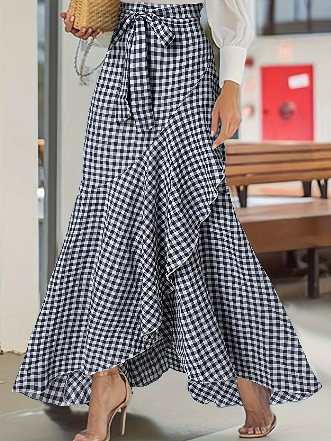 Plaid mermaid irregular skirt from M Chic Boutique, featuring a unique hemline and stylish checkered pattern.