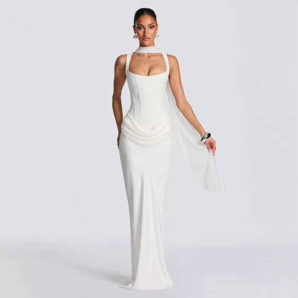 Strapless sleeveless sheath maxi dress by M Chic Boutique, flowing fabric, fitted bodice, and elegant design for formal occasions.