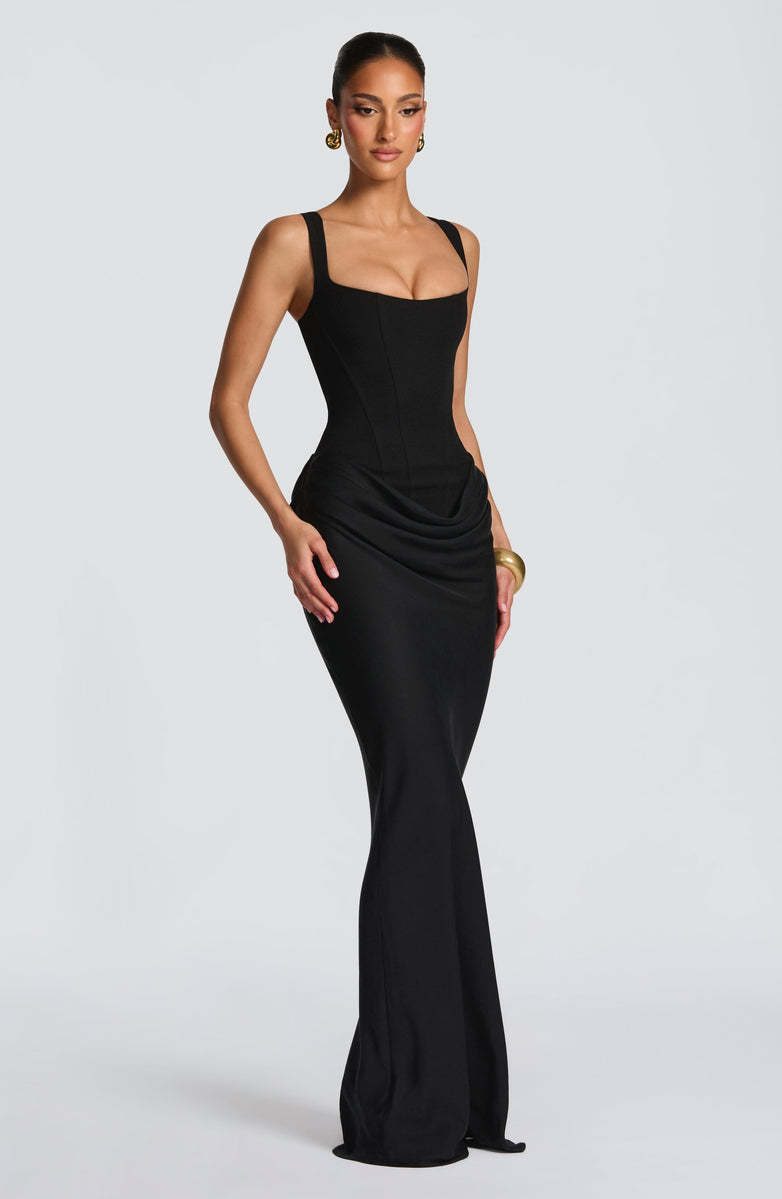 Strapless sleeveless sheath maxi dress from M Chic Boutique displayed on a hanger, featuring a flowing, elegant design.
