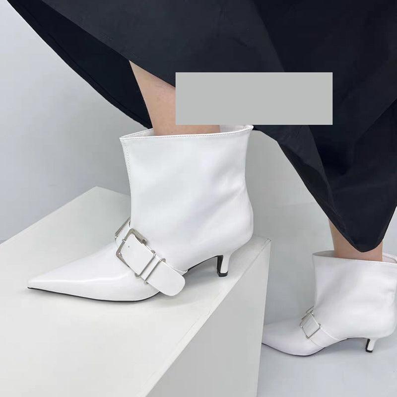 High heel pointed ankle boots by M Chic Boutique featuring a sleek design and elegant silhouette in black leather.