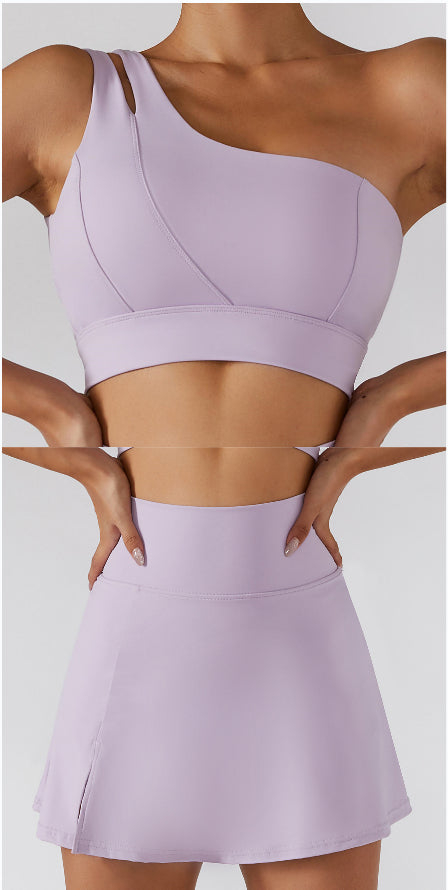 Ribbed one-shoulder gym set by M Chic Boutique, showing a stylish activewear top and matching leggings in a neutral color.