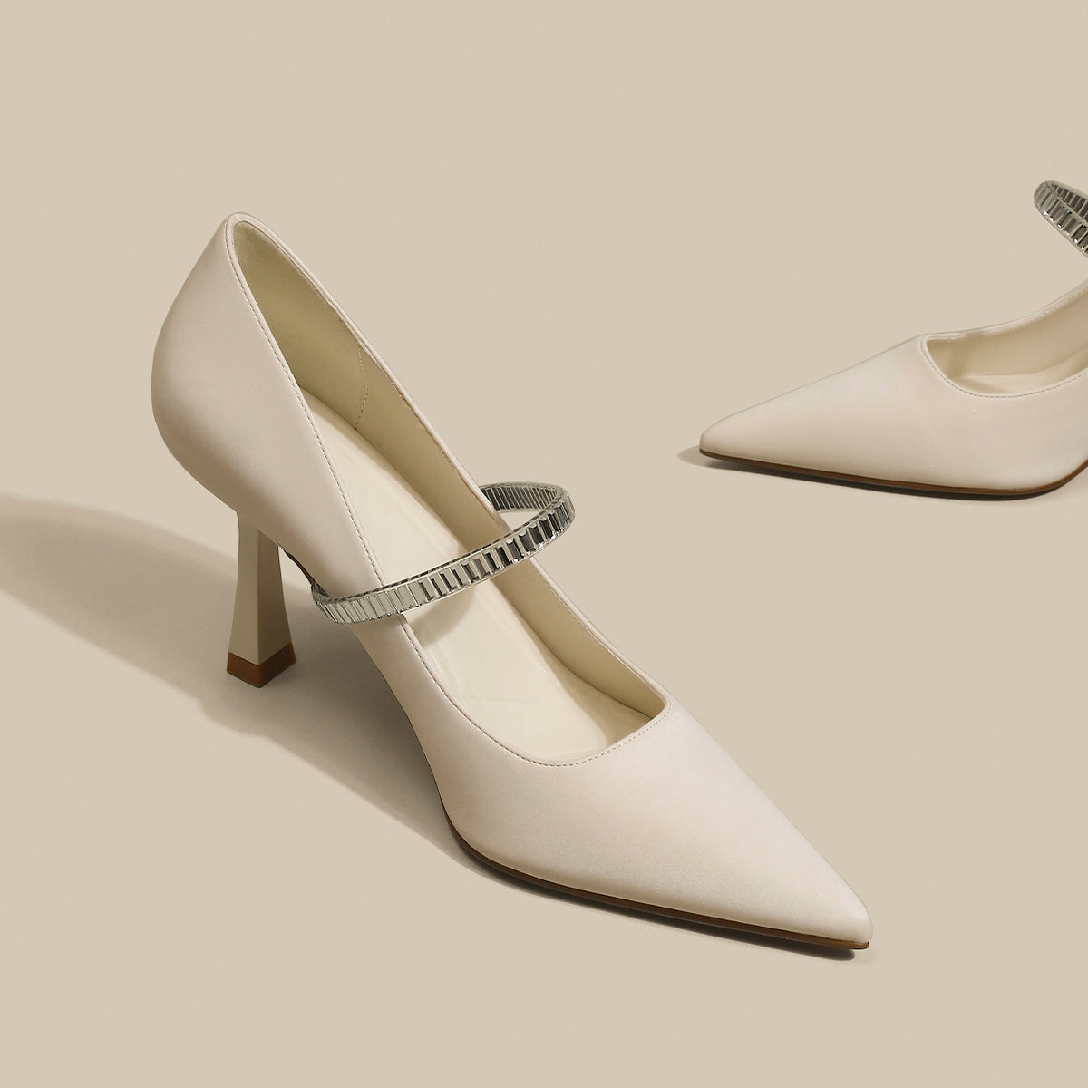 Pointed toe shoes with strap in black, featuring a sleek design and elegant silhouette from M Chic Boutique.
