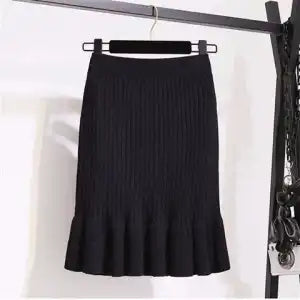 Ruffled high waisted skirt in a flowing design, perfect for a stylish and feminine look by M Chic Boutique.