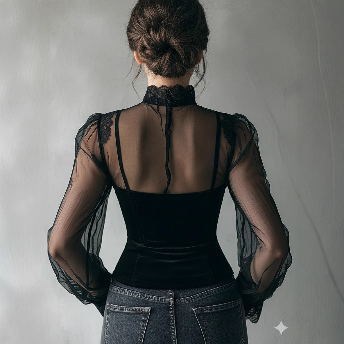 Black lace top with mesh panels, featuring a stylish design ideal for pairing with skirts, by M Chic Boutique.