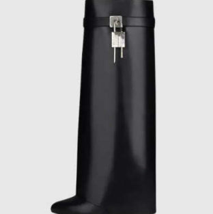 Pair of Lock Wedge Boots from M Chic Boutique, stylish shoes with chunky heels and ankle-length design.