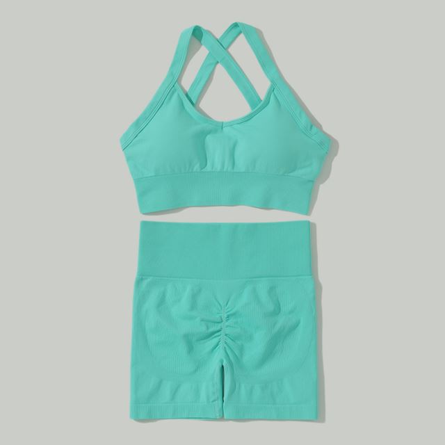 M Chic Boutique sport solid color activewear set featuring a fitted top and matching leggings on a plain background.