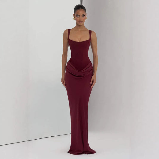 Strapless sleeveless sheath maxi dress in elegant fabric, designed by M Chic Boutique, displayed on a neutral background.