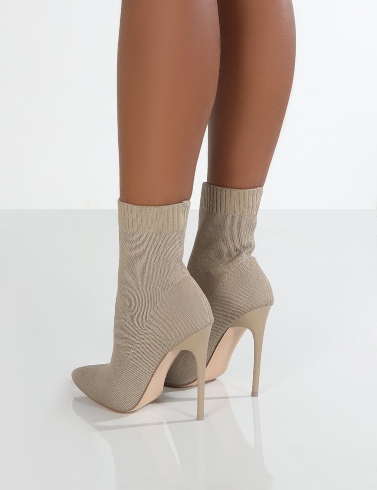 High-heel point-toe knitted boots in black from M Chic Boutique, showcasing a stylish and modern design.