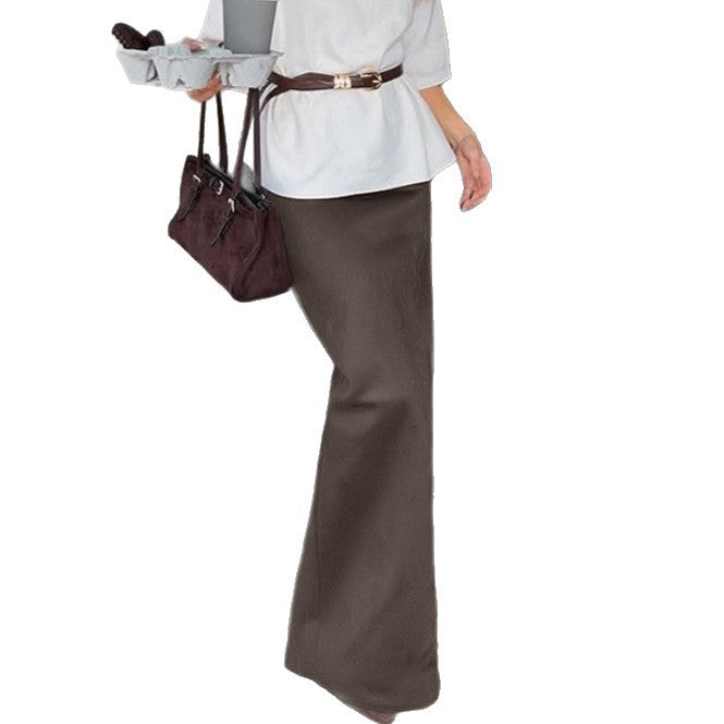 Mid-length slit fishtail skirt in black, featuring a fitted silhouette and elegant flare from M Chic Boutique.