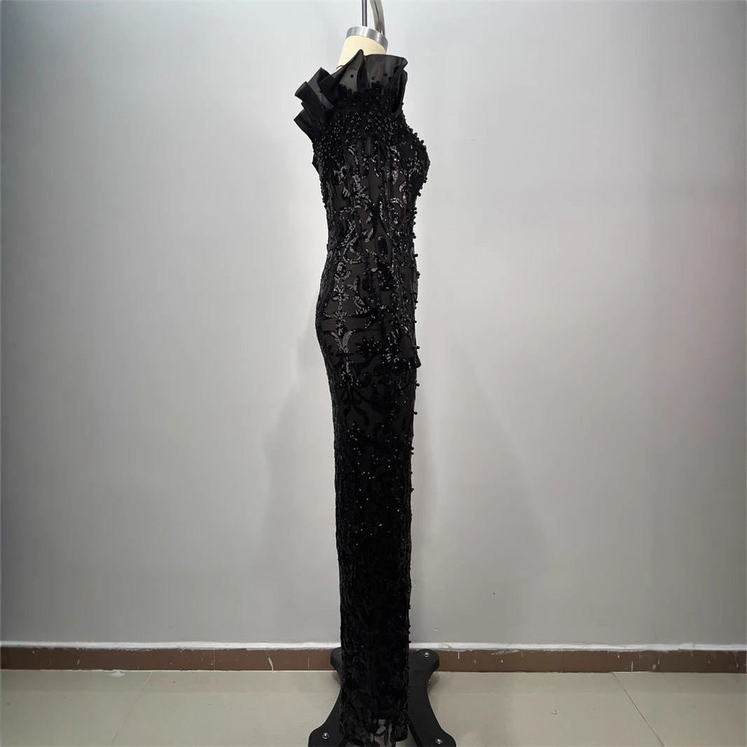 One shoulder slit dress with sequins and embroidery from M Chic Boutique, showcasing elegant design and shimmering details.
