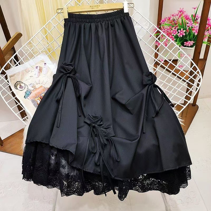 High-waisted bow midi skirt in flowy fabric, featuring a stylish bow detail and elegant silhouette by M Chic Boutique.