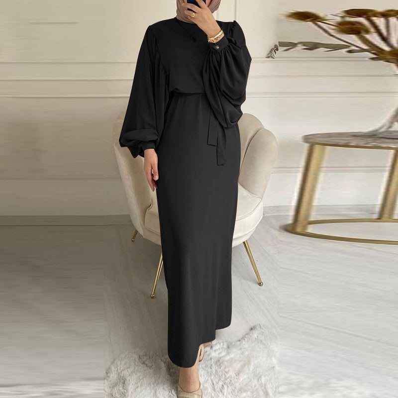Solid color elegant dress by M Chic Boutique, featuring a fitted silhouette and a sleek, modern design.