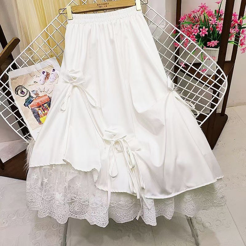 High-waisted bow midi skirt in a flowing fabric, featuring a stylish bow detail, perfect for elegant outfits.