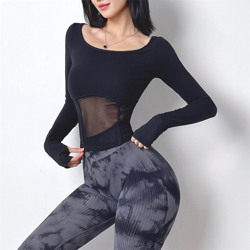 M Chic Boutique Mesh Dry Gym Top displayed on a hanger, showcasing lightweight, breathable activewear for workout or casual wear.